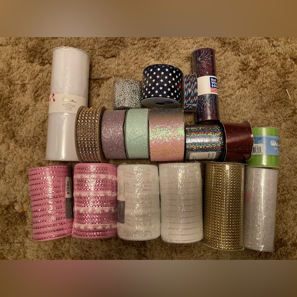 18 rolls of Assorted Craft Ribbon & tulle. Most never opened. All full rolls
